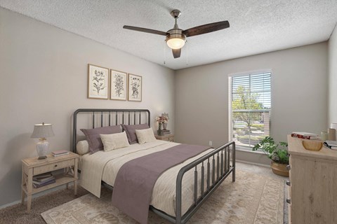 a bedroom with a bed and a ceiling fan at Acacia Gardens, New Mexico, 87111